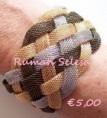 Metalen gevlochten armband met Kleuren Goud,Zilver en zwart met magneet sluiting